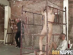 Twink bitch get oiled up in cage and fucked hard